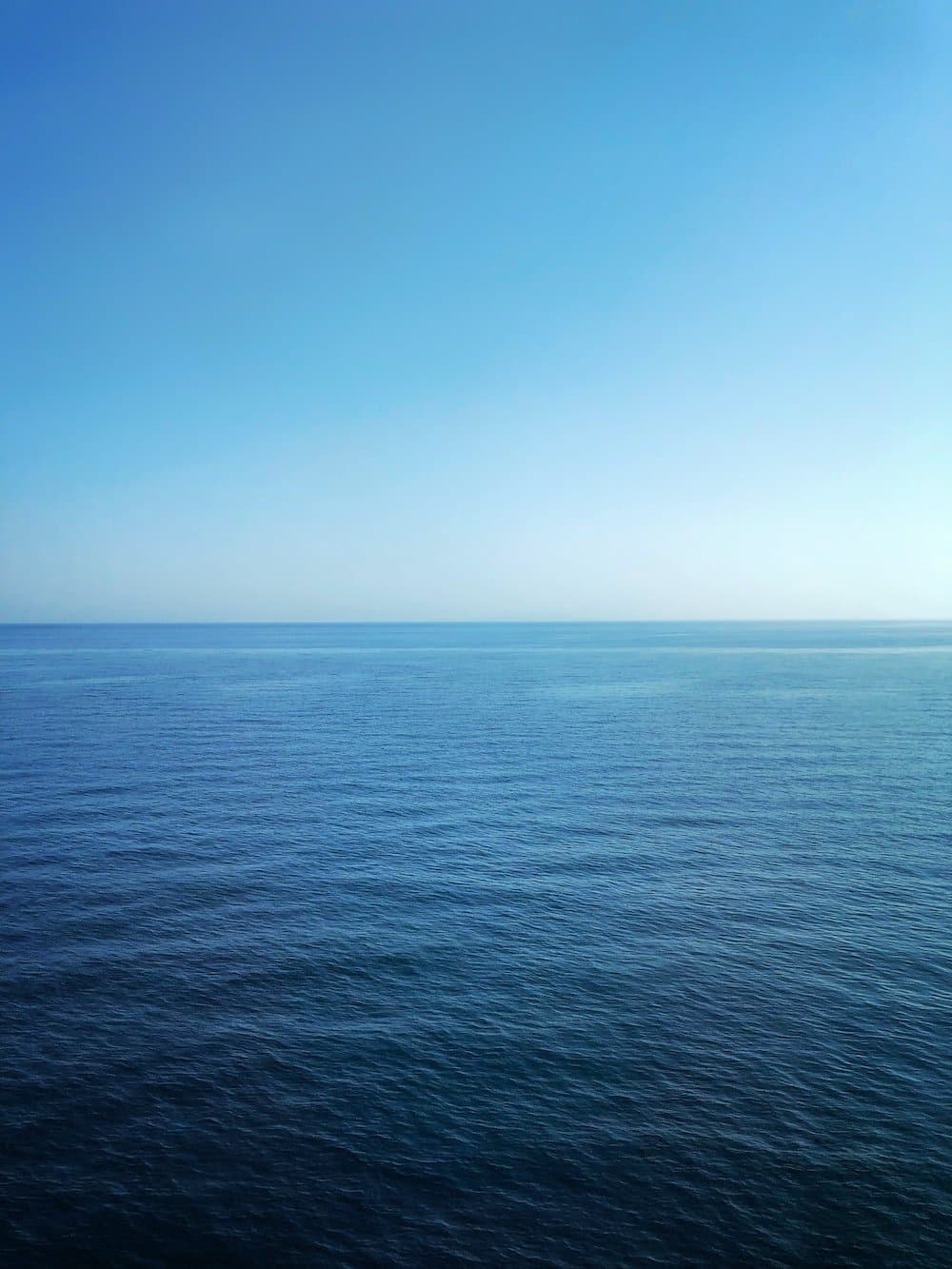 Calm blue ocean, the original Sea Blue Property Partners brand image
